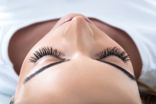 Close-up of a woman with fresh eyelash extensions